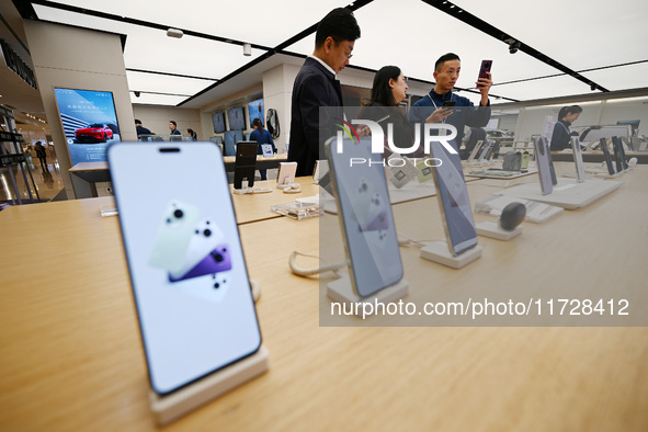 Customers shop for mobile phones at the Huawei store at Deji Square in Nanjing, China, on November 1, 2024. 