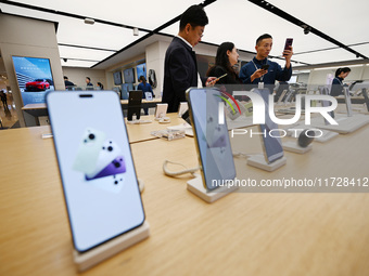 Customers shop for mobile phones at the Huawei store at Deji Square in Nanjing, China, on November 1, 2024. (