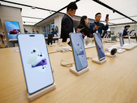 Customers shop for mobile phones at the Huawei store at Deji Square in Nanjing, China, on November 1, 2024. (