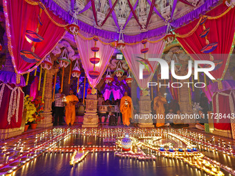 Priests perform 'aarti' at the Akshardham temple during the 'Deepotsav' celebration on the occasion of the 'Diwali' festival in Jaipur, Raja...