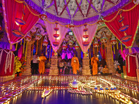 Priests perform 'aarti' at the Akshardham temple during the 'Deepotsav' celebration on the occasion of the 'Diwali' festival in Jaipur, Raja...