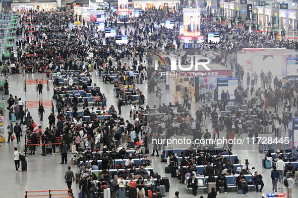 The waiting hall of Hongqiao Railway Station in Shanghai, China, on November 1, 2024, is crowded with passengers. Affected by Typhoon Kong-R...