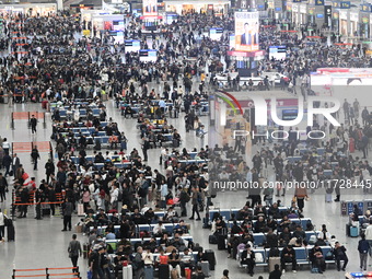 The waiting hall of Hongqiao Railway Station in Shanghai, China, on November 1, 2024, is crowded with passengers. Affected by Typhoon Kong-R...