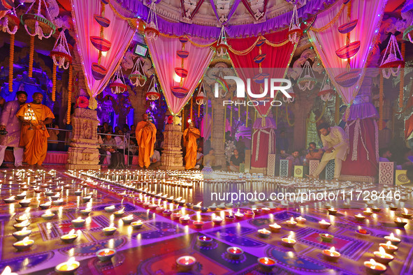 Priests perform 'aarti' at the Akshardham temple during the 'Deepotsav' celebration on the occasion of the 'Diwali' festival in Jaipur, Raja...