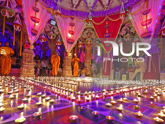 Priests perform 'aarti' at the Akshardham temple during the 'Deepotsav' celebration on the occasion of the 'Diwali' festival in Jaipur, Raja...