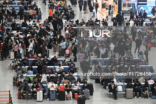 The waiting hall of Hongqiao Railway Station in Shanghai, China, on November 1, 2024, is crowded with passengers. Affected by Typhoon Kong-R...