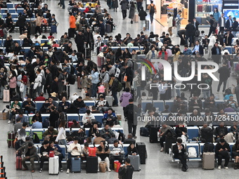 The waiting hall of Hongqiao Railway Station in Shanghai, China, on November 1, 2024, is crowded with passengers. Affected by Typhoon Kong-R...