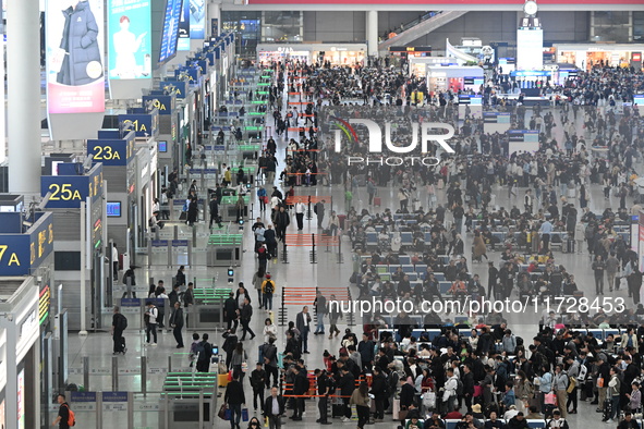 The waiting hall of Hongqiao Railway Station in Shanghai, China, on November 1, 2024, is crowded with passengers. Affected by Typhoon Kong-R...