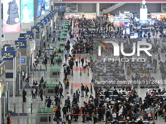 The waiting hall of Hongqiao Railway Station in Shanghai, China, on November 1, 2024, is crowded with passengers. Affected by Typhoon Kong-R...