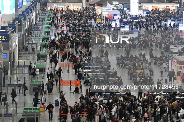 The waiting hall of Hongqiao Railway Station in Shanghai, China, on November 1, 2024, is crowded with passengers. Affected by Typhoon Kong-R...