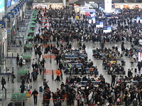 The waiting hall of Hongqiao Railway Station in Shanghai, China, on November 1, 2024, is crowded with passengers. Affected by Typhoon Kong-R...