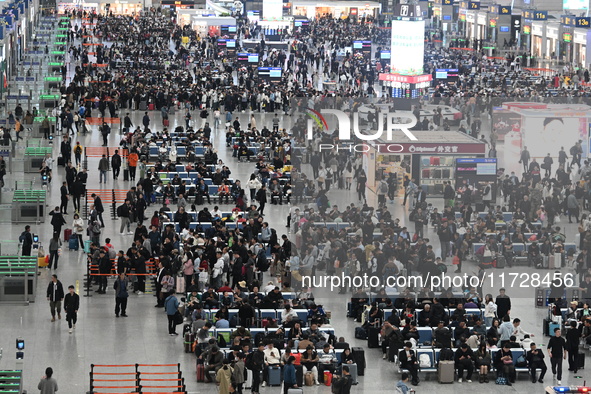 The waiting hall of Hongqiao Railway Station in Shanghai, China, on November 1, 2024, is crowded with passengers. Affected by Typhoon Kong-R...