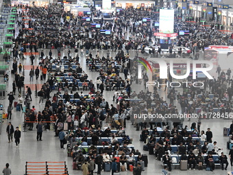 The waiting hall of Hongqiao Railway Station in Shanghai, China, on November 1, 2024, is crowded with passengers. Affected by Typhoon Kong-R...