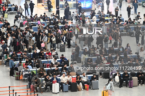 The waiting hall of Hongqiao Railway Station in Shanghai, China, on November 1, 2024, is crowded with passengers. Affected by Typhoon Kong-R...