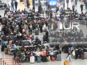 The waiting hall of Hongqiao Railway Station in Shanghai, China, on November 1, 2024, is crowded with passengers. Affected by Typhoon Kong-R...