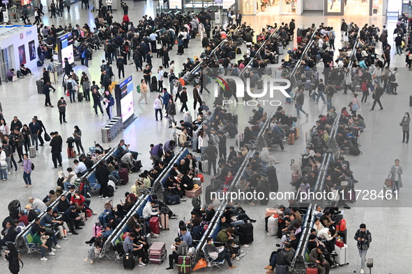 The waiting hall of Hongqiao Railway Station in Shanghai, China, on November 1, 2024, is crowded with passengers. Affected by Typhoon Kong-R...