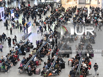 The waiting hall of Hongqiao Railway Station in Shanghai, China, on November 1, 2024, is crowded with passengers. Affected by Typhoon Kong-R...