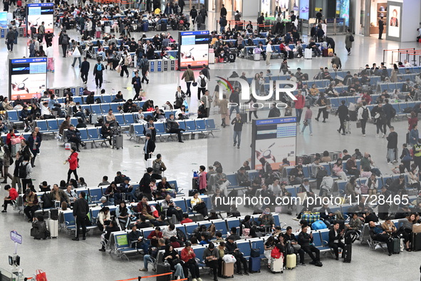 The waiting hall of Hongqiao Railway Station in Shanghai, China, on November 1, 2024, is crowded with passengers. Affected by Typhoon Kong-R...