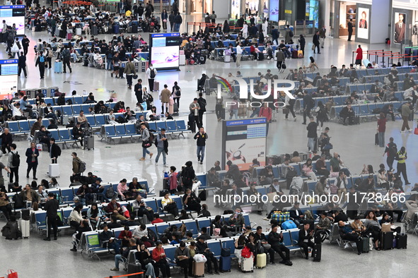 The waiting hall of Hongqiao Railway Station in Shanghai, China, on November 1, 2024, is crowded with passengers. Affected by Typhoon Kong-R...