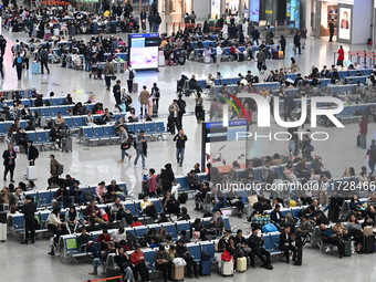 The waiting hall of Hongqiao Railway Station in Shanghai, China, on November 1, 2024, is crowded with passengers. Affected by Typhoon Kong-R...