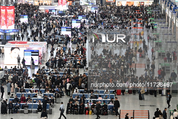 The waiting hall of Hongqiao Railway Station in Shanghai, China, on November 1, 2024, is crowded with passengers. Affected by Typhoon Kong-R...