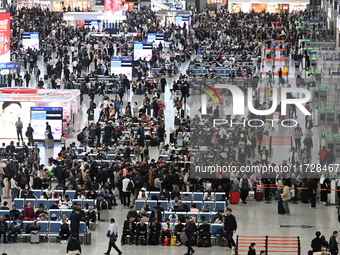 The waiting hall of Hongqiao Railway Station in Shanghai, China, on November 1, 2024, is crowded with passengers. Affected by Typhoon Kong-R...