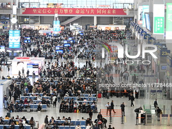 The waiting hall of Hongqiao Railway Station in Shanghai, China, on November 1, 2024, is crowded with passengers. Affected by Typhoon Kong-R...