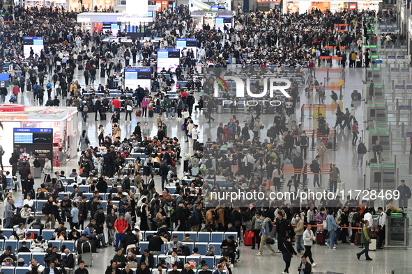 The waiting hall of Hongqiao Railway Station in Shanghai, China, on November 1, 2024, is crowded with passengers. Affected by Typhoon Kong-R...