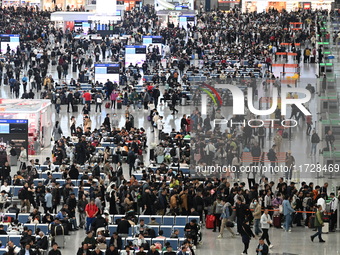 The waiting hall of Hongqiao Railway Station in Shanghai, China, on November 1, 2024, is crowded with passengers. Affected by Typhoon Kong-R...