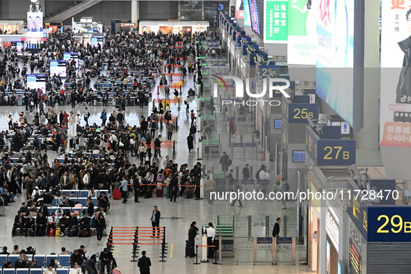 The waiting hall of Hongqiao Railway Station in Shanghai, China, on November 1, 2024, is crowded with passengers. Affected by Typhoon Kong-R...