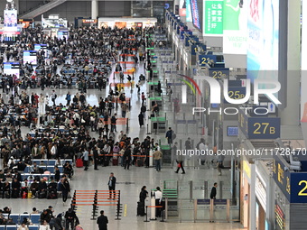 The waiting hall of Hongqiao Railway Station in Shanghai, China, on November 1, 2024, is crowded with passengers. Affected by Typhoon Kong-R...