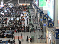 The waiting hall of Hongqiao Railway Station in Shanghai, China, on November 1, 2024, is crowded with passengers. Affected by Typhoon Kong-R...