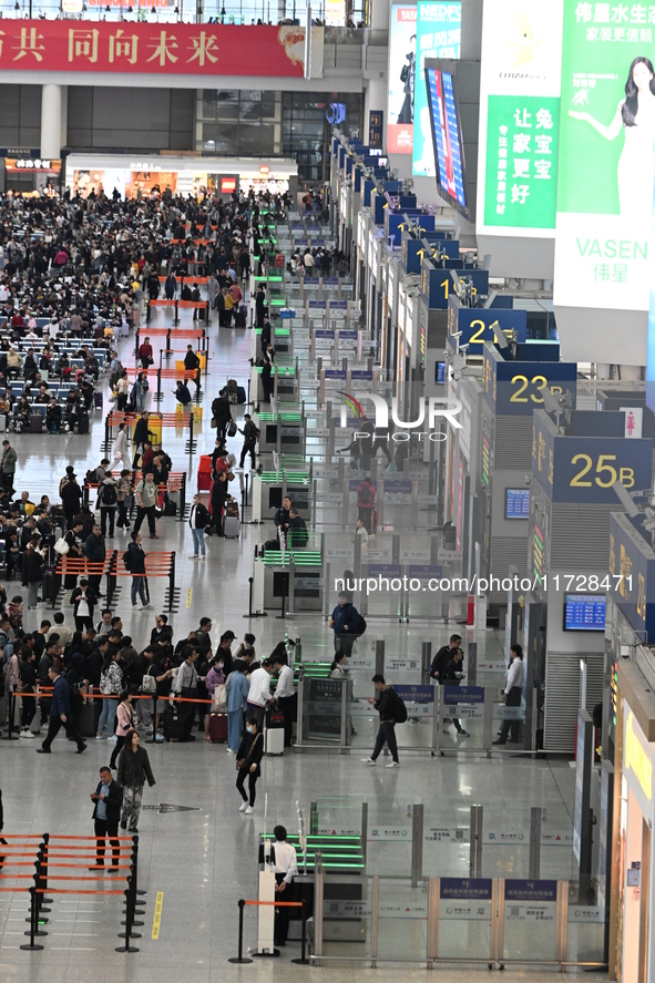 The waiting hall of Hongqiao Railway Station in Shanghai, China, on November 1, 2024, is crowded with passengers. Affected by Typhoon Kong-R...