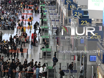 The waiting hall of Hongqiao Railway Station in Shanghai, China, on November 1, 2024, is crowded with passengers. Affected by Typhoon Kong-R...