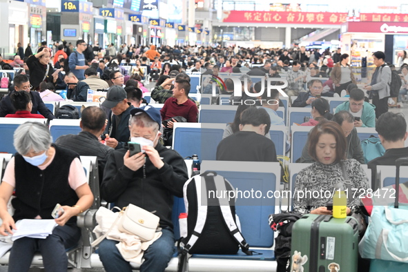 The waiting hall of Hongqiao Railway Station in Shanghai, China, on November 1, 2024, is crowded with passengers. Affected by Typhoon Kong-R...