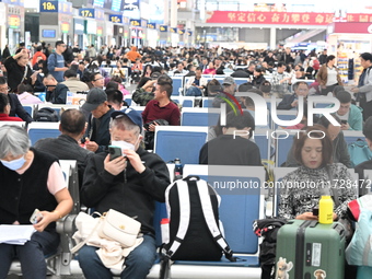 The waiting hall of Hongqiao Railway Station in Shanghai, China, on November 1, 2024, is crowded with passengers. Affected by Typhoon Kong-R...