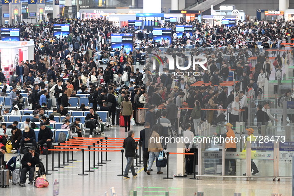 The waiting hall of Hongqiao Railway Station in Shanghai, China, on November 1, 2024, is crowded with passengers. Affected by Typhoon Kong-R...