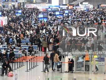 The waiting hall of Hongqiao Railway Station in Shanghai, China, on November 1, 2024, is crowded with passengers. Affected by Typhoon Kong-R...