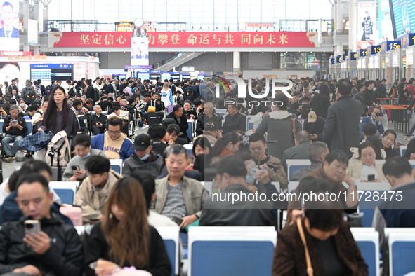 The waiting hall of Hongqiao Railway Station in Shanghai, China, on November 1, 2024, is crowded with passengers. Affected by Typhoon Kong-R...