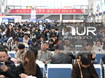 The waiting hall of Hongqiao Railway Station in Shanghai, China, on November 1, 2024, is crowded with passengers. Affected by Typhoon Kong-R...