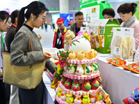 Visitors learn about Huamo products at the 2024 Yantai International Food (Prepared Dish) Industry Expo in Yantai, China, on November 1, 202...