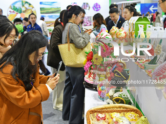 Visitors learn about Huamo products at the 2024 Yantai International Food (Prepared Dish) Industry Expo in Yantai, China, on November 1, 202...