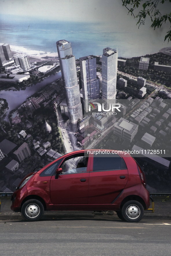 A car stops next to the large cutout in Colombo, Sri Lanka, on October 31, 2024 