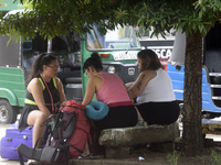 A group of tourists sits in front of Colombo railway station in Colombo, Sri Lanka, on November 1, 2024. The tourism sector shows remarkable...