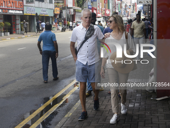 Tourists walk in Colombo Fort in Colombo, Sri Lanka, on November 1, 2024. The tourism sector shows remarkable financial recovery, with earni...