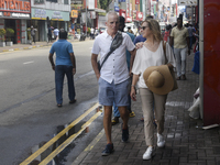 Tourists walk in Colombo Fort in Colombo, Sri Lanka, on November 1, 2024. The tourism sector shows remarkable financial recovery, with earni...