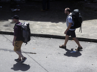 Tourists walk next to the Colombo railway station in Colombo, Sri Lanka, on November 1, 2024. The tourism sector shows remarkable financial...