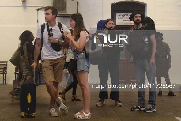 A group of tourists waits for the train at Colombo railway station in Colombo, Sri Lanka, on November 1, 2024. The tourism sector shows rema...