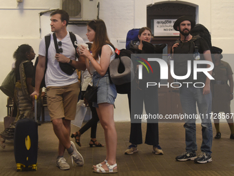 A group of tourists waits for the train at Colombo railway station in Colombo, Sri Lanka, on November 1, 2024. The tourism sector shows rema...