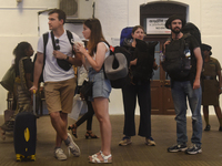 A group of tourists waits for the train at Colombo railway station in Colombo, Sri Lanka, on November 1, 2024. The tourism sector shows rema...